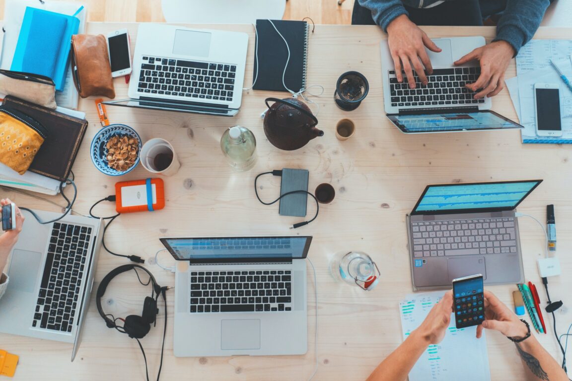 Image of people working on their laptops.